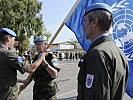 Mit der UN-Fahne übernahm Oberstleutnant Erkinger offiziell das Kommando. (Bild öffnet sich in einem neuen Fenster)