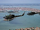 Two Austrian AB-212 helicopters fly over Venice. (Image opens in new window)