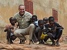An Austrian officer with children in Mali. (Image opens in new window)