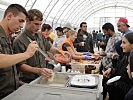 In eastern Austria, soldiers help by providing food for refugees. (Image opens in new window)