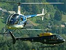 R22 und AS 350B beim Landeanflug. (Bild öffnet sich in einem neuen Fenster)