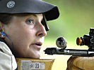 Eine Sportlerin wirft einen zufriedenen Blick auf den Anzeigemonitor. (Bild öffnet sich in einem neuen Fenster)
