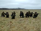 Special Forces squad waiting for a helicopter lift. (Image opens in new window)