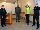 Anita Zinner, Martin Jawurek, Christof Chwojka und Christian Föhringer bei der errichteten Impfstraße in der Hesser-Kaserne.